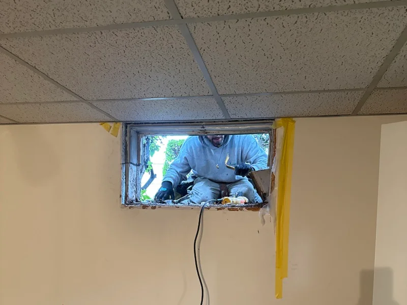 Using a grinder to remove a window frame